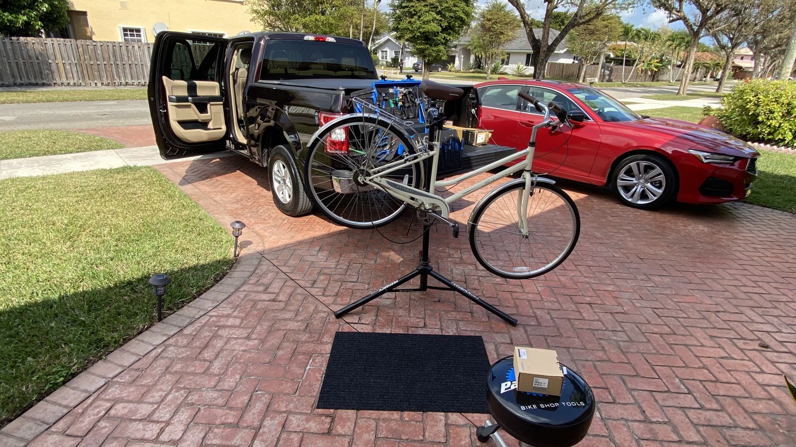 Bike on a repair stand in a driveway