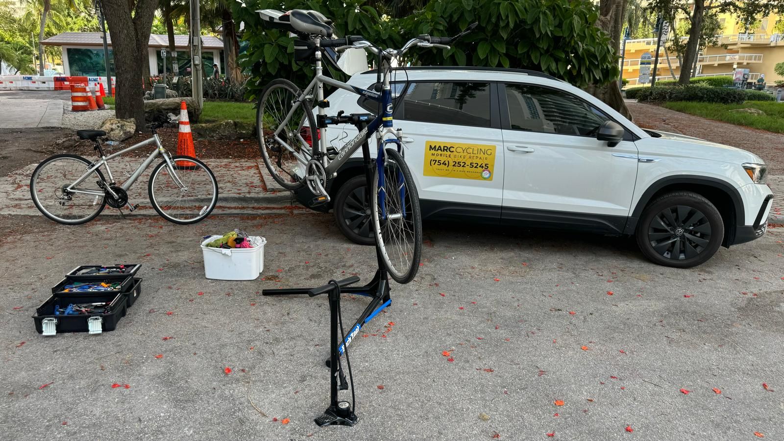 Bike on a stand beside the service van