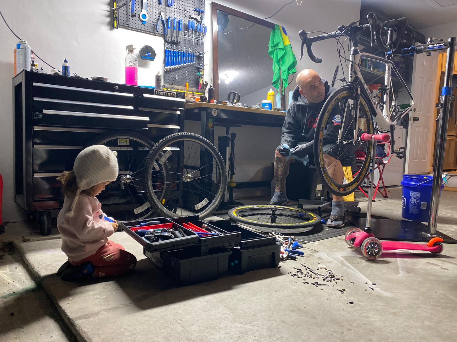 Family watching an at-home bike repair